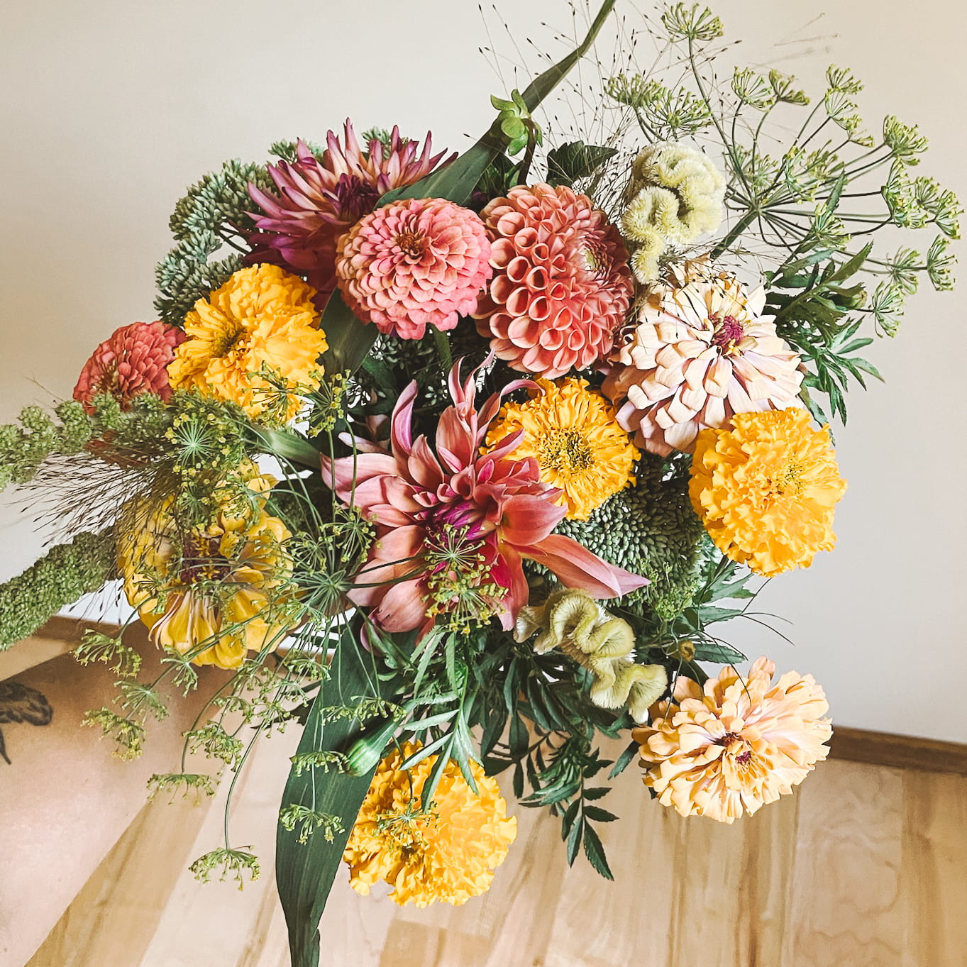 A single hand-tied bouquet on a kitchen table.